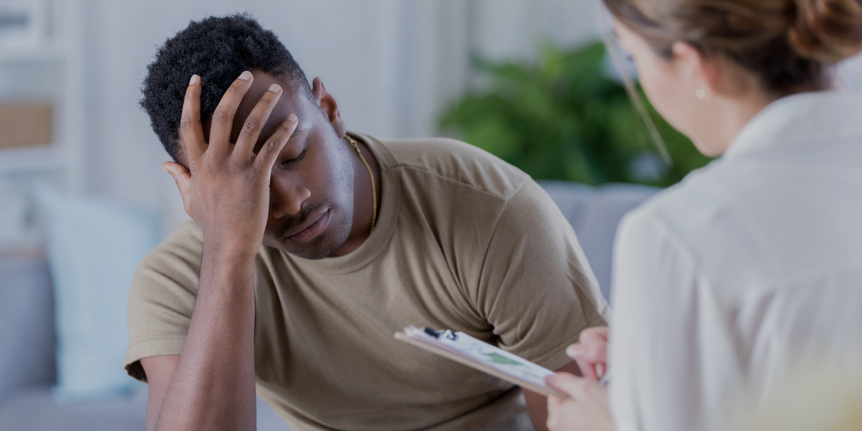 Upset soldier talks with therapist